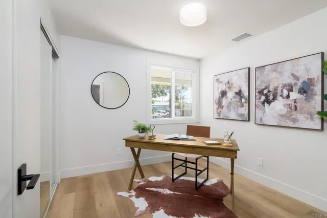 a workspace with furniture and window