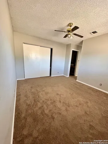 a view of a big room with windows