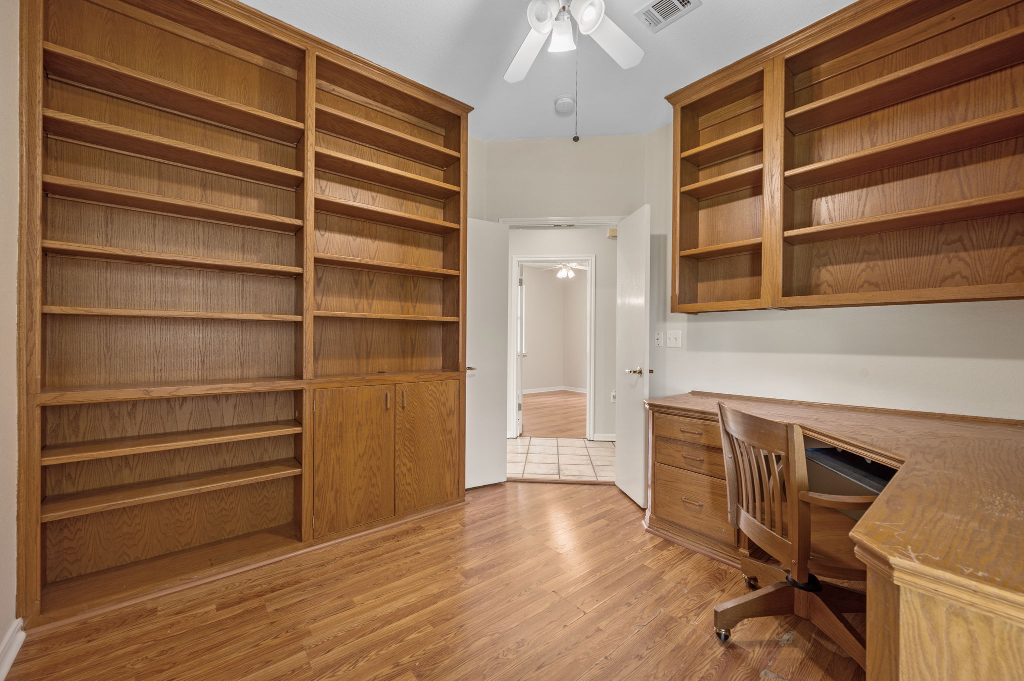 118 Bass Street Georgetown, TX 78633 - Photo 31 of 40 Built-in shelving and desk provide a dedicated, organized workspace.