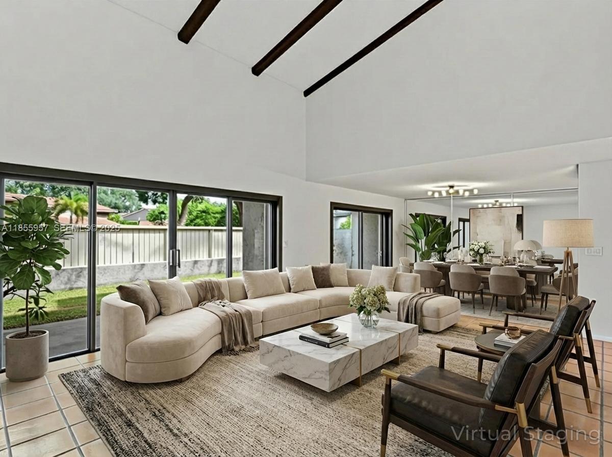 203 Bonnie Brae Way, Unit 34 Hollywood, FL 33021 - Photo 1 of 41 a living room with furniture and a large window