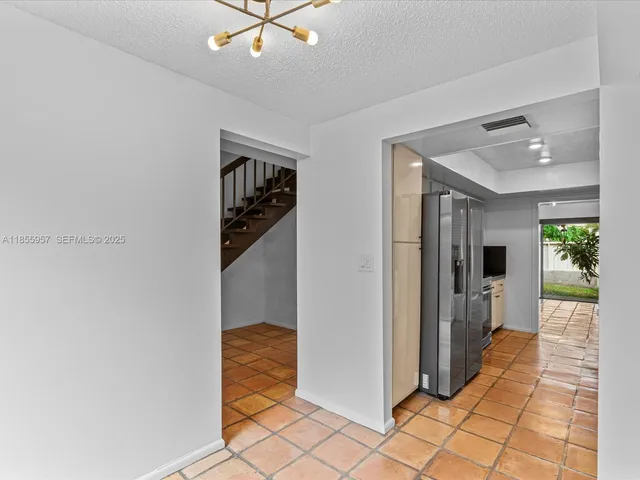 a view of a hallway view with staircase