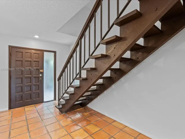 a view of an entryway with staircase