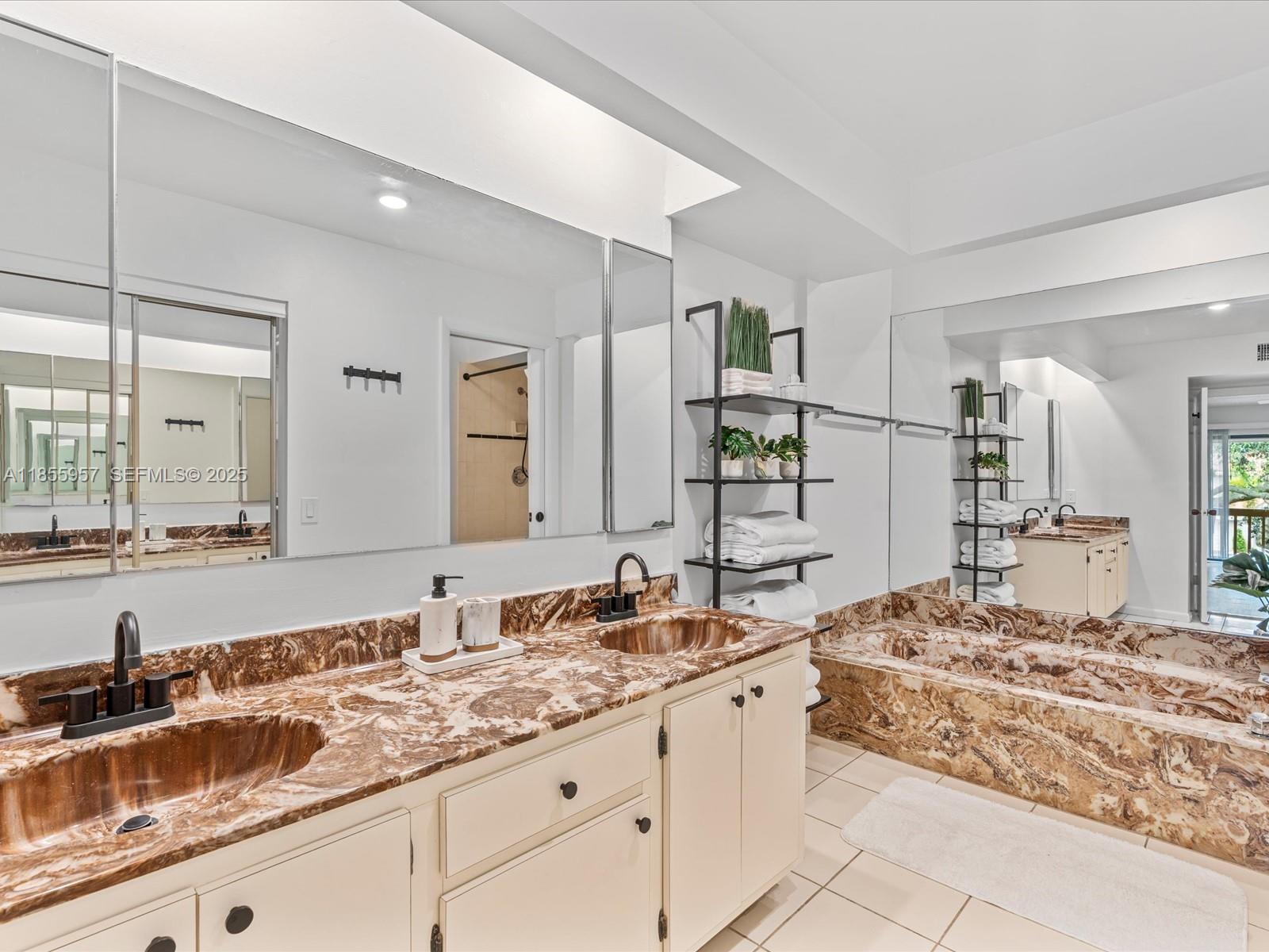 203 Bonnie Brae Way, Unit 34 Hollywood, FL 33021 - Photo 32 of 41 a bathroom with a granite countertop sink and a mirror