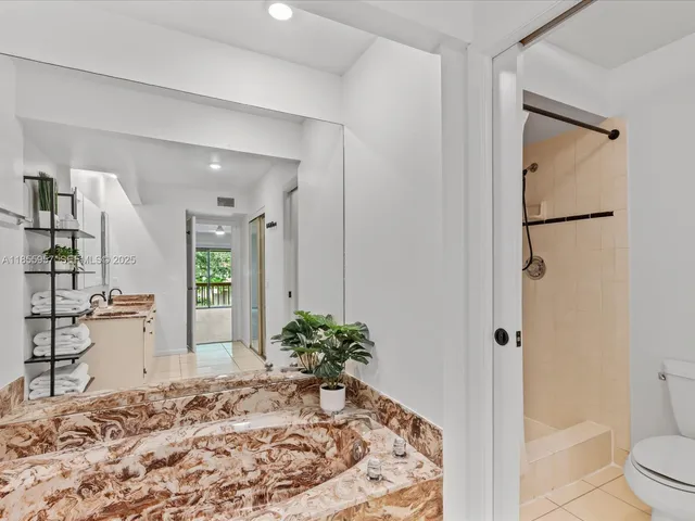 front view of a house with a potted plant