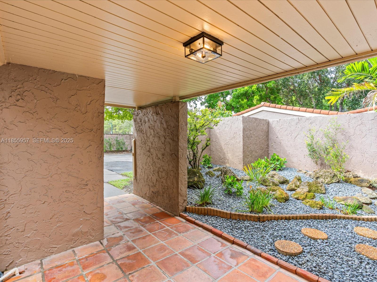 203 Bonnie Brae Way, Unit 34 Hollywood, FL 33021 - Photo 36 of 41 a view of a backyard with potted plants