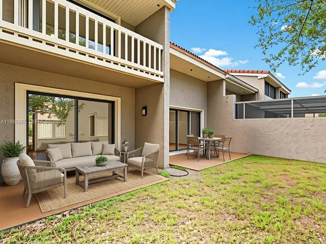 a view of a patio with swimming pool table and chairs