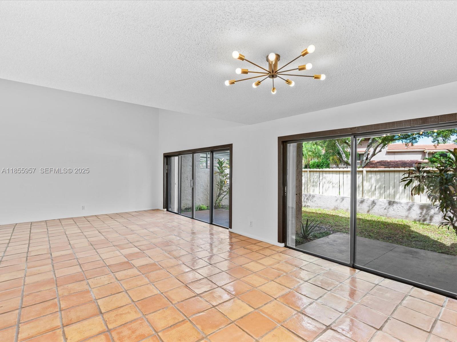 203 Bonnie Brae Way, Unit 34 Hollywood, FL 33021 - Photo 8 of 41 a view of an empty room with a window