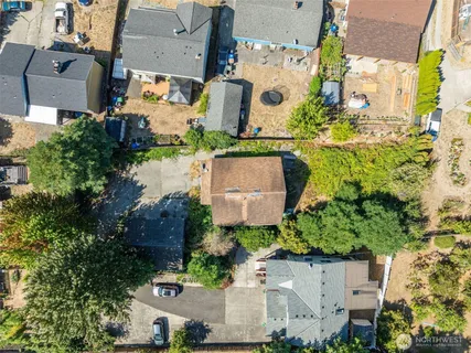 an aerial view of residential houses with outdoor space