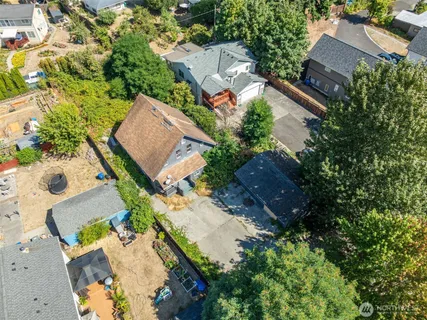 an aerial view of house with yard