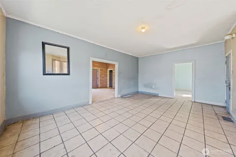 a view of an empty room and window