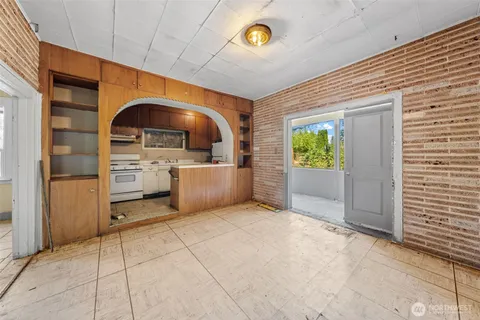 a view of a kitchen with furniture and a window