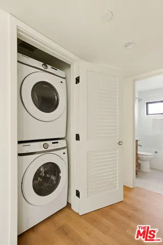 a view of a hallway with washer and dryer