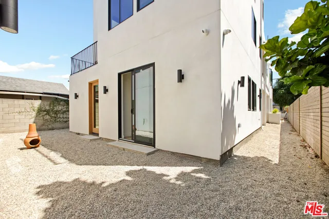 a view of a back yard with porch