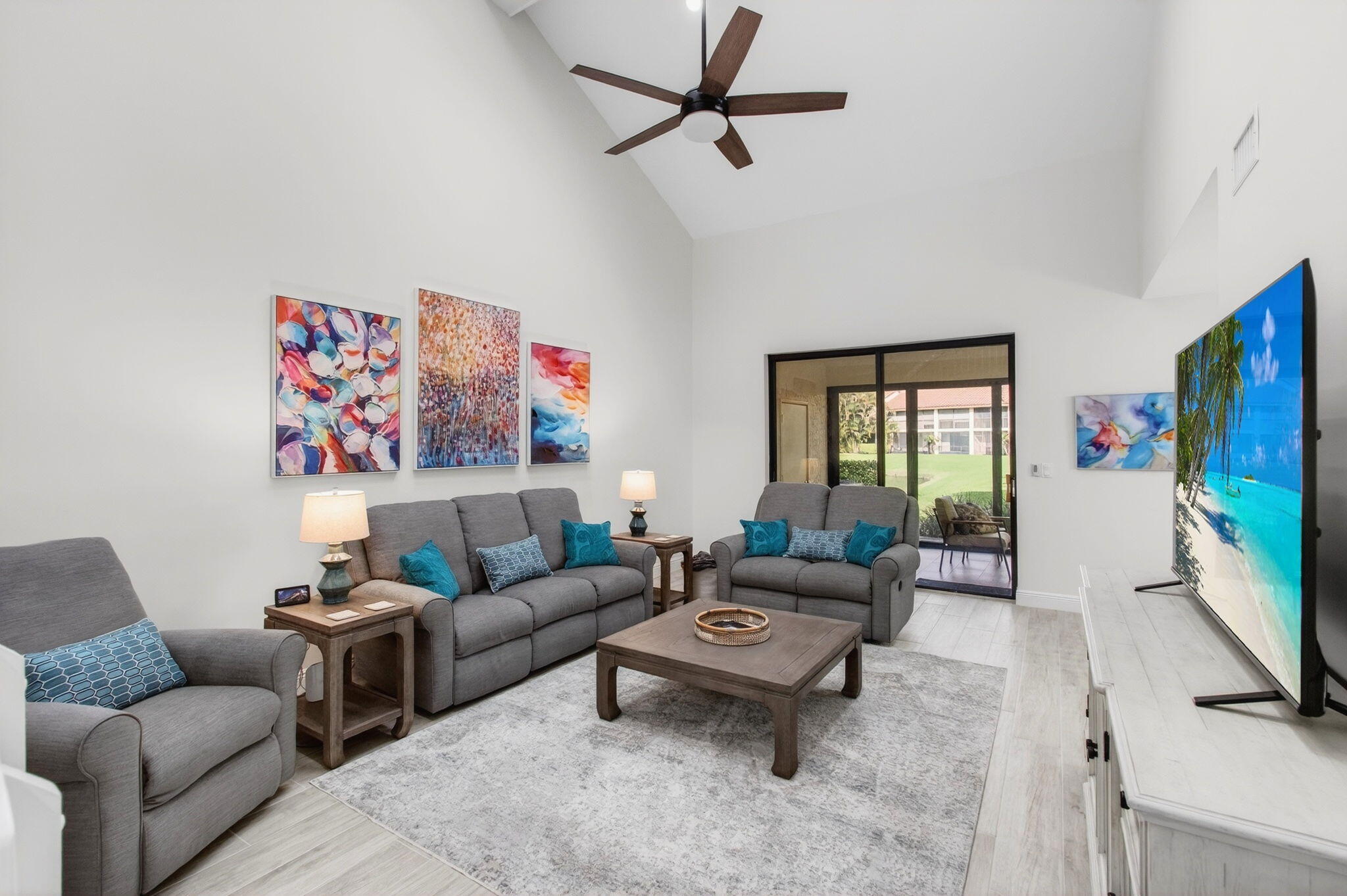 7727 La Mirada Drive Boca Raton, FL 33433 - Photo 13 of 91 a living room with furniture a flat screen tv and a window