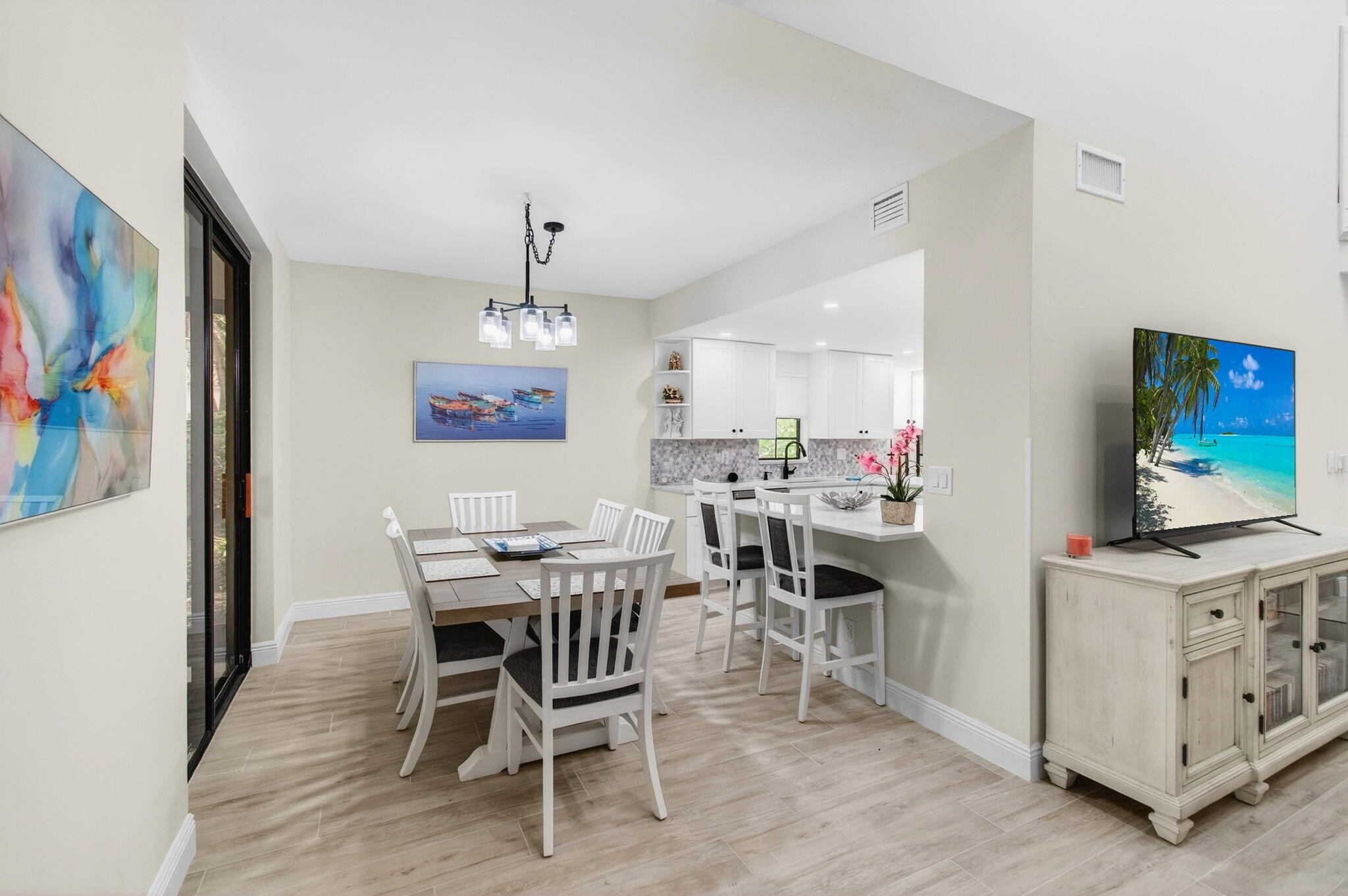 7727 La Mirada Drive Boca Raton, FL 33433 - Photo 19 of 91 a view of a dining room with furniture and wooden floor