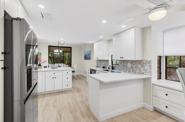 a bedroom with a bed dresser and a window