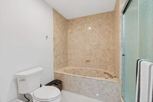 an aerial view of residential houses with outdoor space and swimming pool