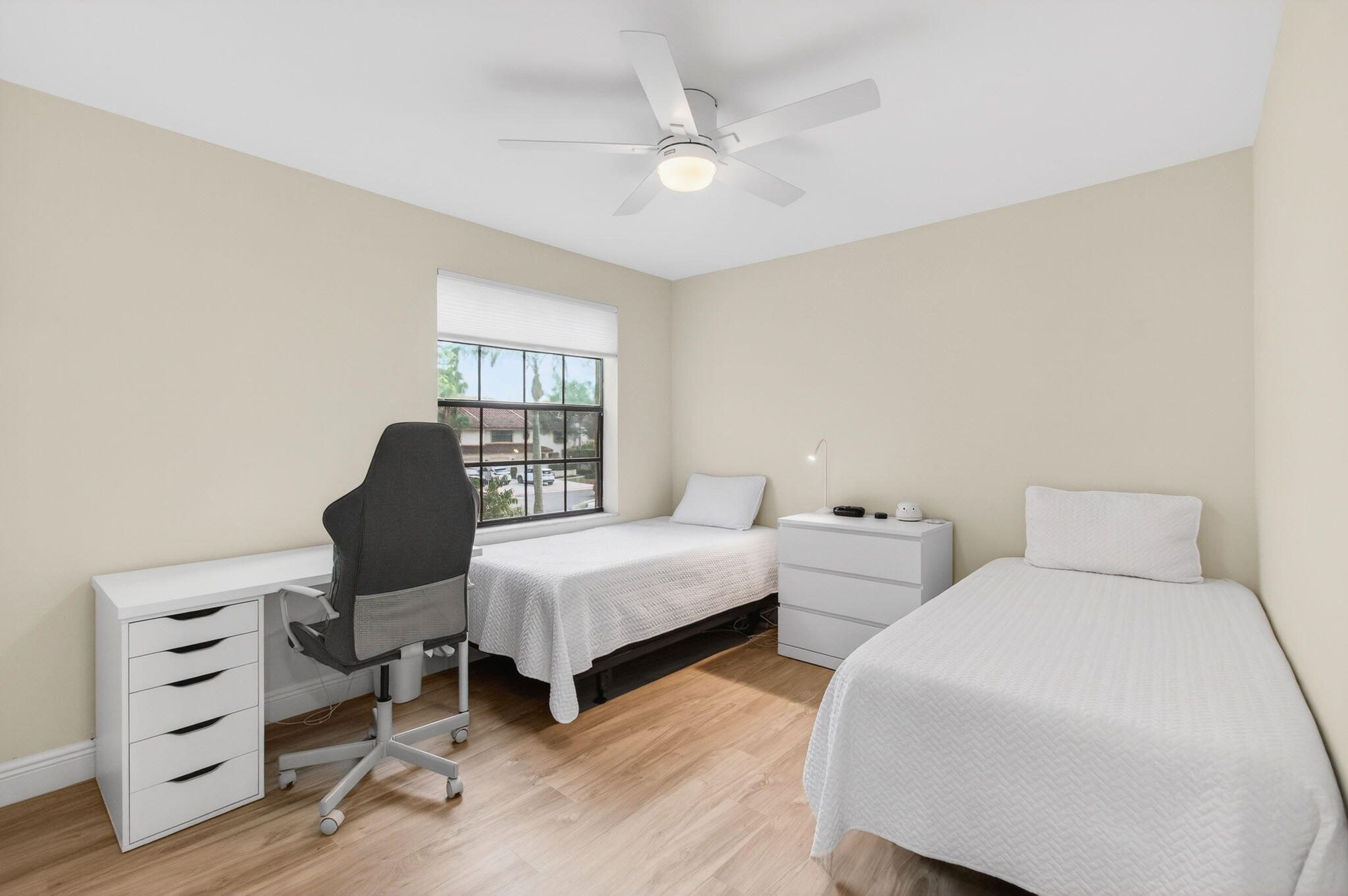 7727 La Mirada Drive Boca Raton, FL 33433 - Photo 47 of 91 a bedroom with two beds and a dresser with wooden floor