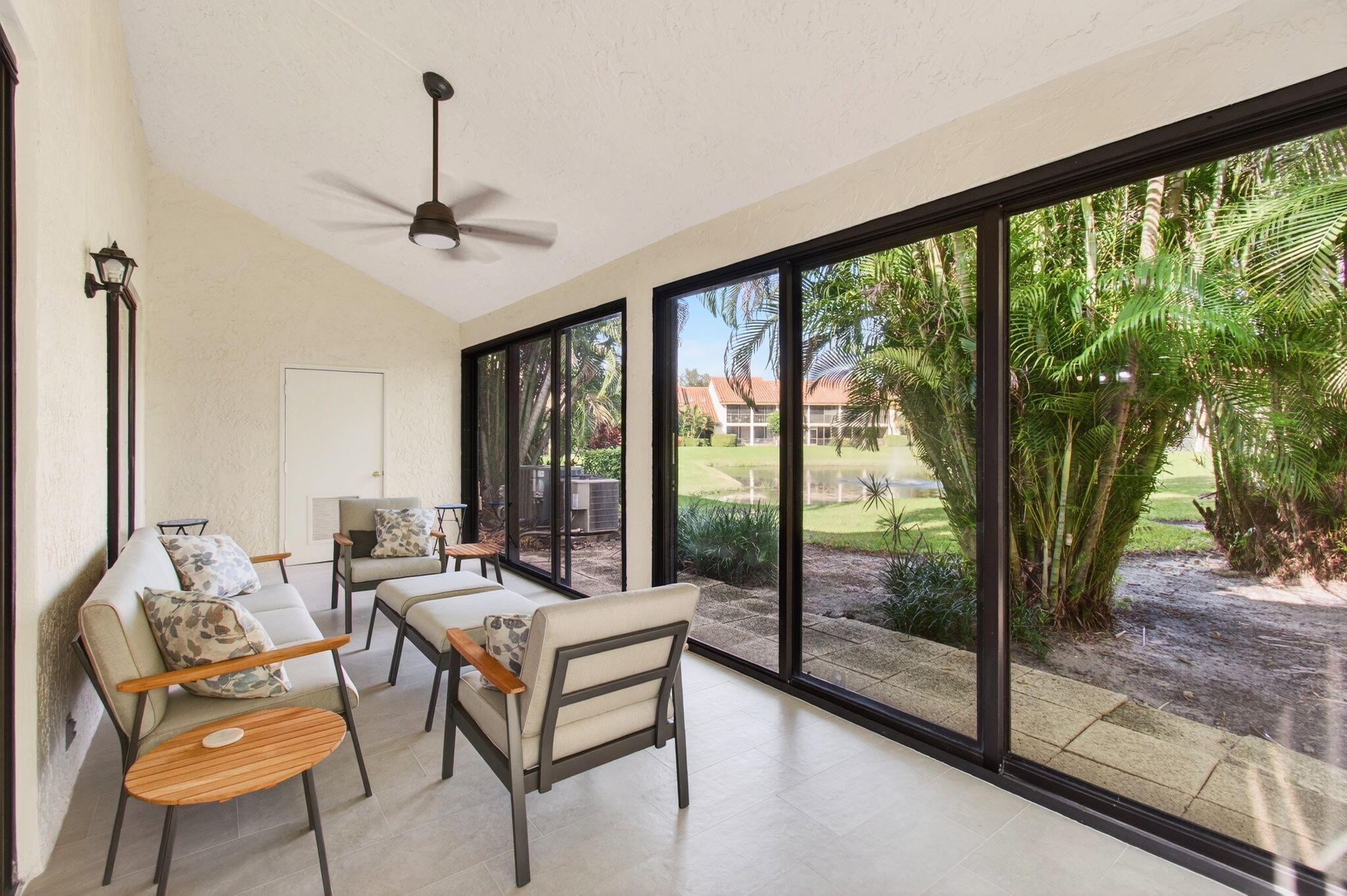 7727 La Mirada Drive Boca Raton, FL 33433 - Photo 56 of 91 a living room with furniture and a floor to ceiling window