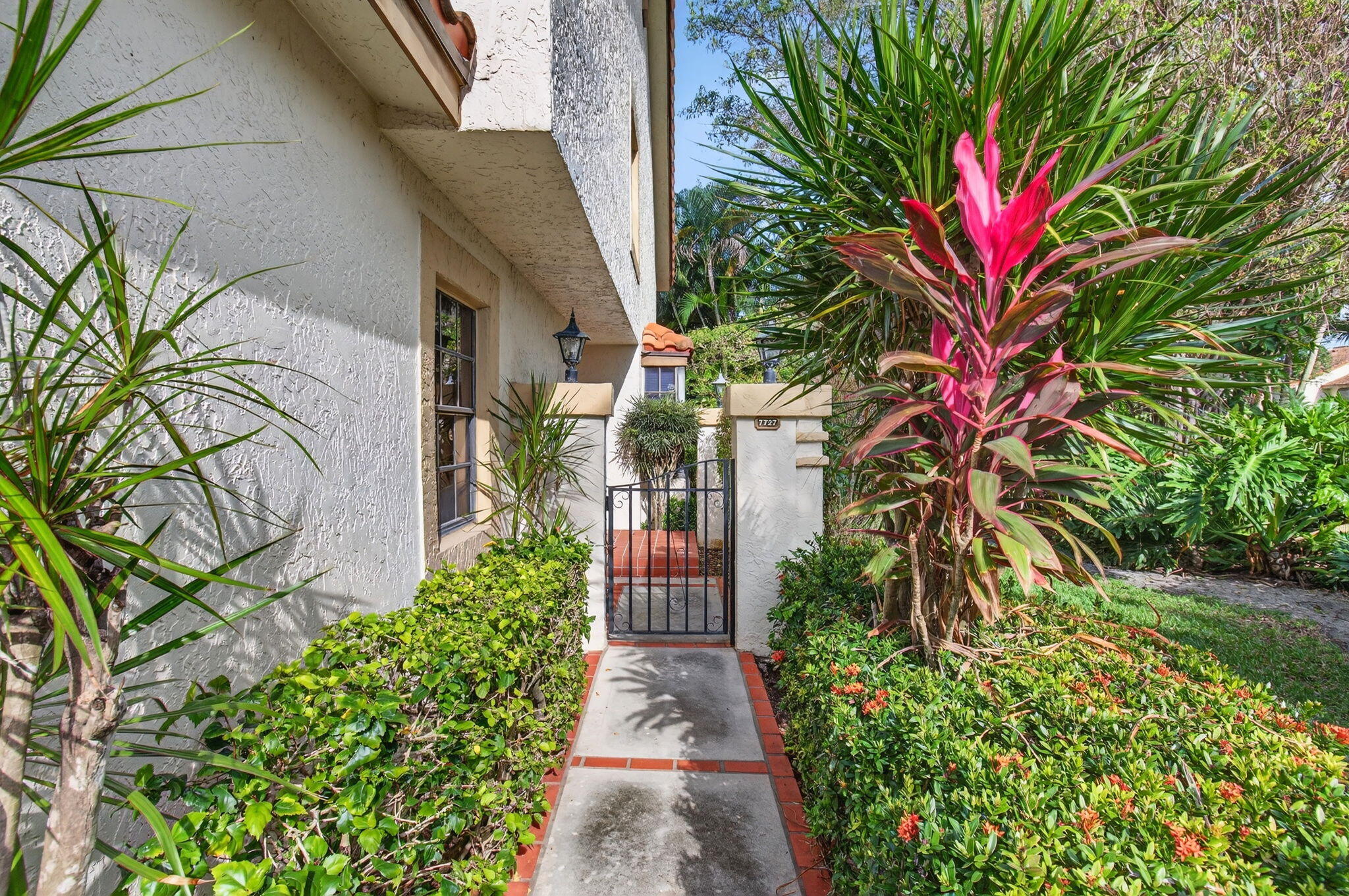 7727 La Mirada Drive Boca Raton, FL 33433 - Photo 71 of 91 a flower plants in front of a building