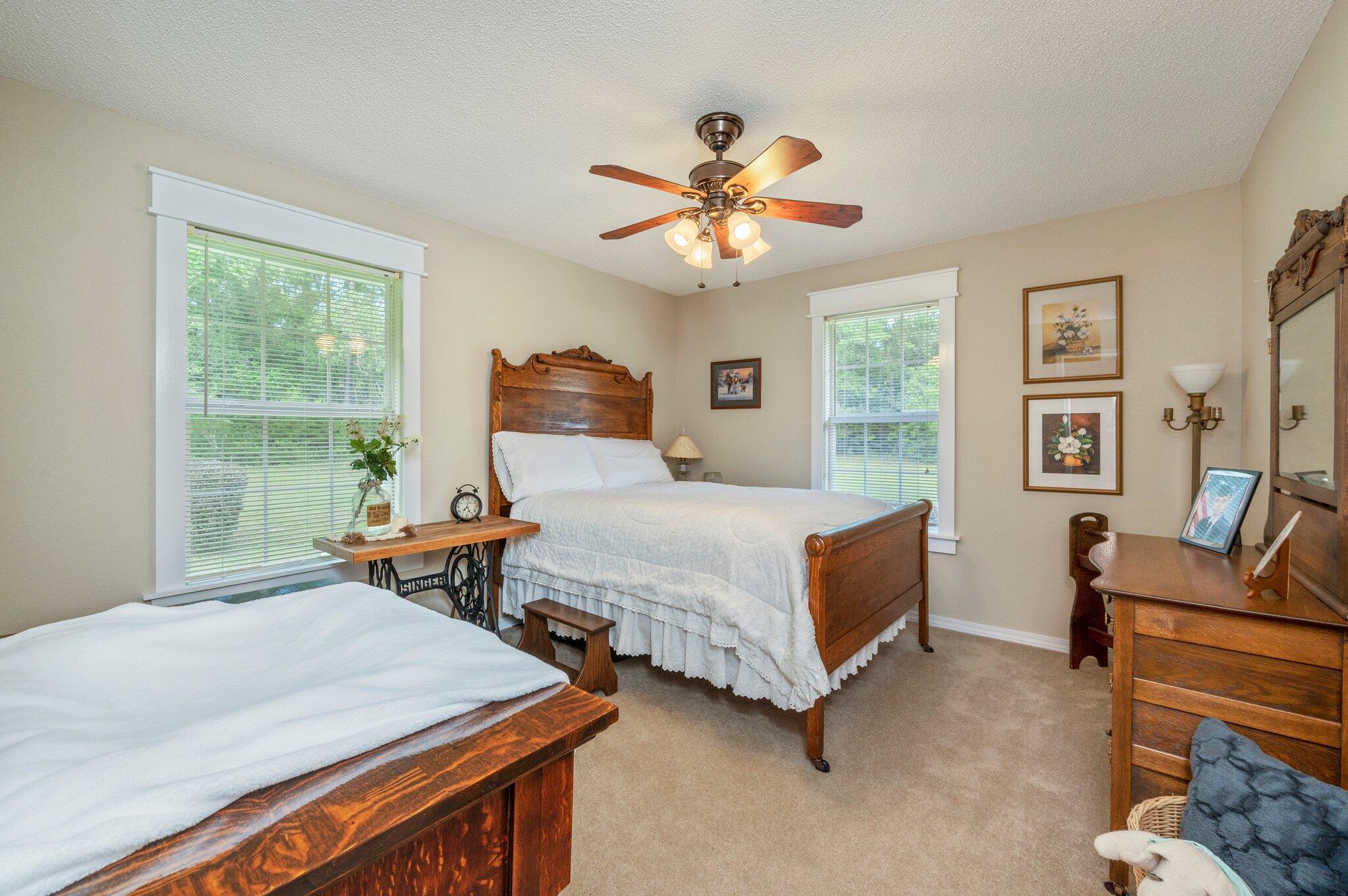 1084 Reeves Road Baker, FL 32531 - Photo 11 of 37 a bedroom with two beds and a large window