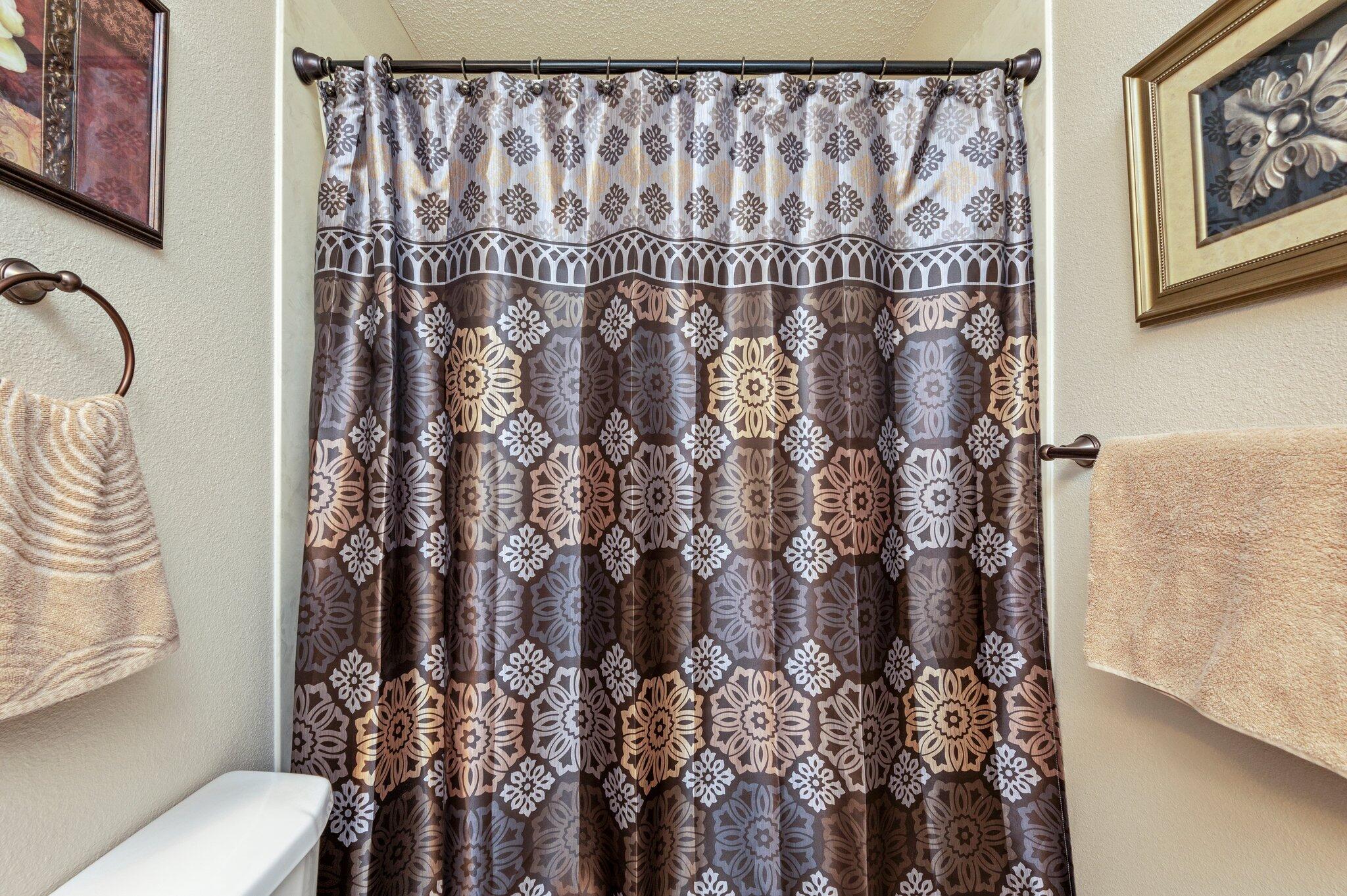 1084 Reeves Road Baker, FL 32531 - Photo 14 of 37 a bathroom with a toilet and shower curtain