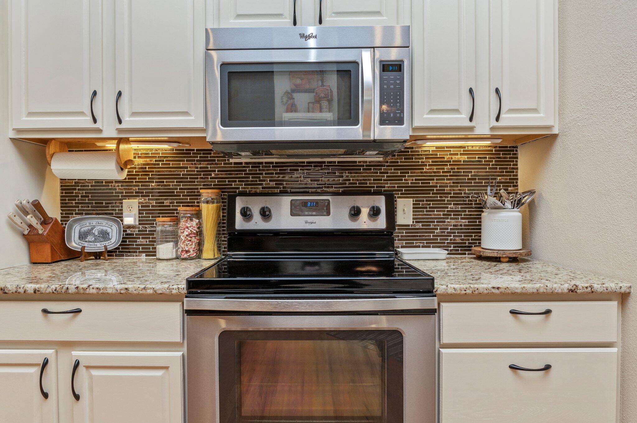1084 Reeves Road Baker, FL 32531 - Photo 16 of 37 a stove top oven sitting inside of a kitchen