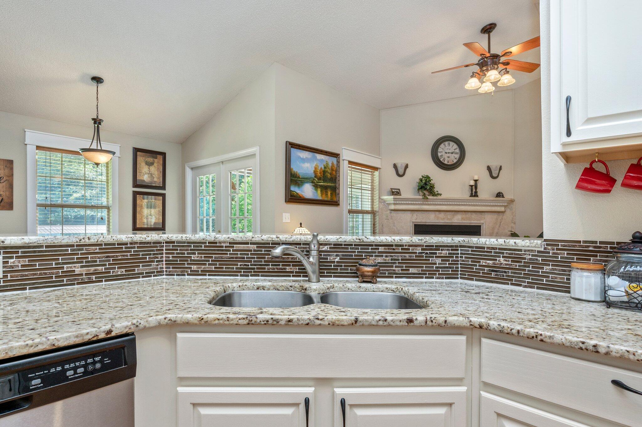 1084 Reeves Road Baker, FL 32531 - Photo 17 of 37 a kitchen with a sink a stove and cabinets