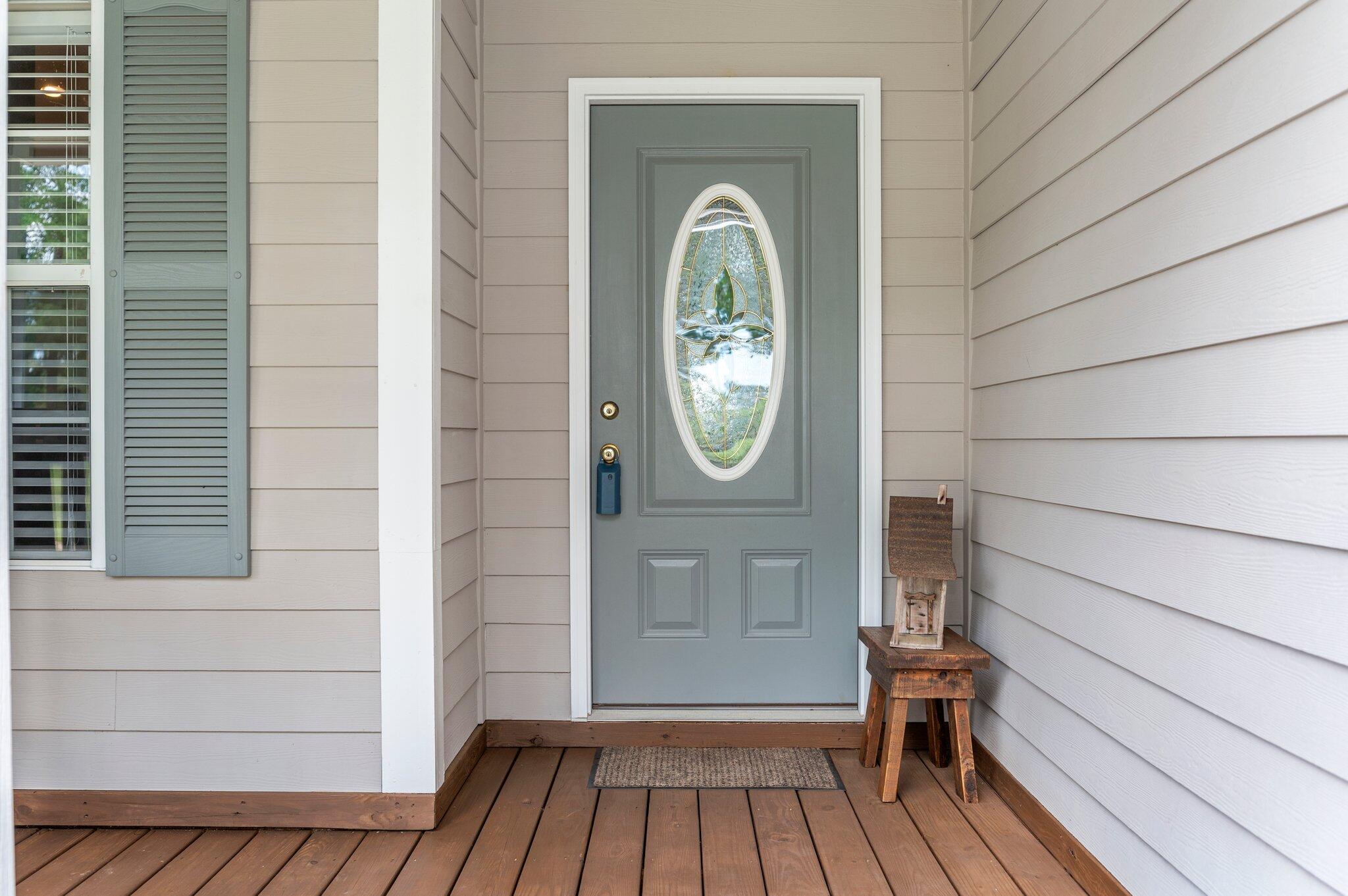 1084 Reeves Road Baker, FL 32531 - Photo 2 of 37 a view of a house with wooden floor and a door