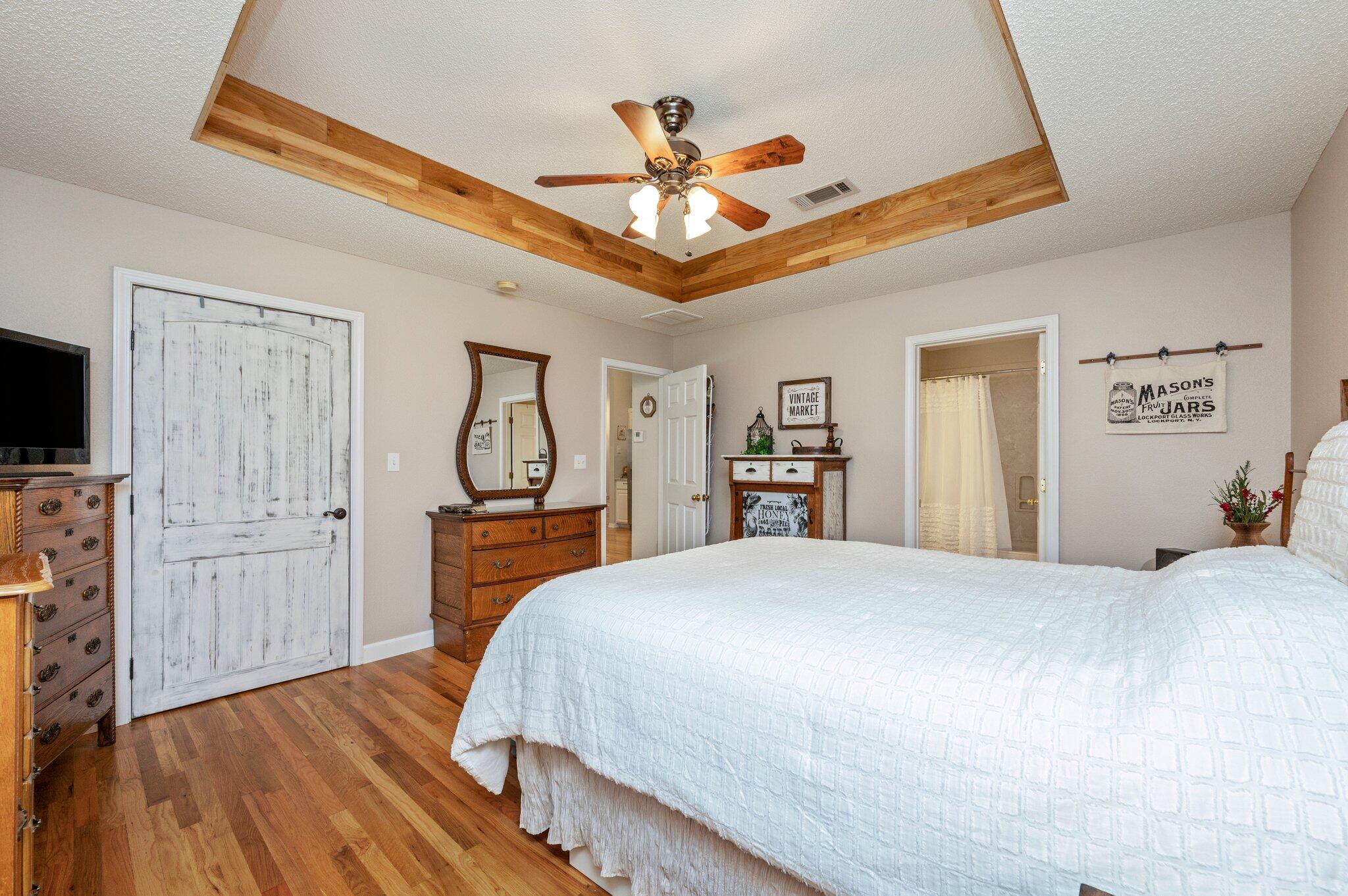 1084 Reeves Road Baker, FL 32531 - Photo 22 of 37 a bedroom with a bed dresser and a flat tv screen