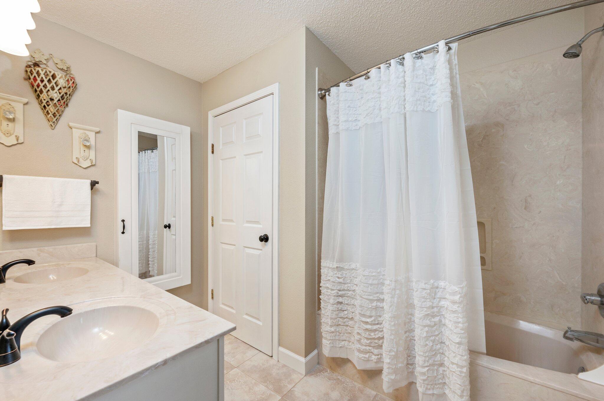 1084 Reeves Road Baker, FL 32531 - Photo 23 of 37 a bathroom with a sink and a tub