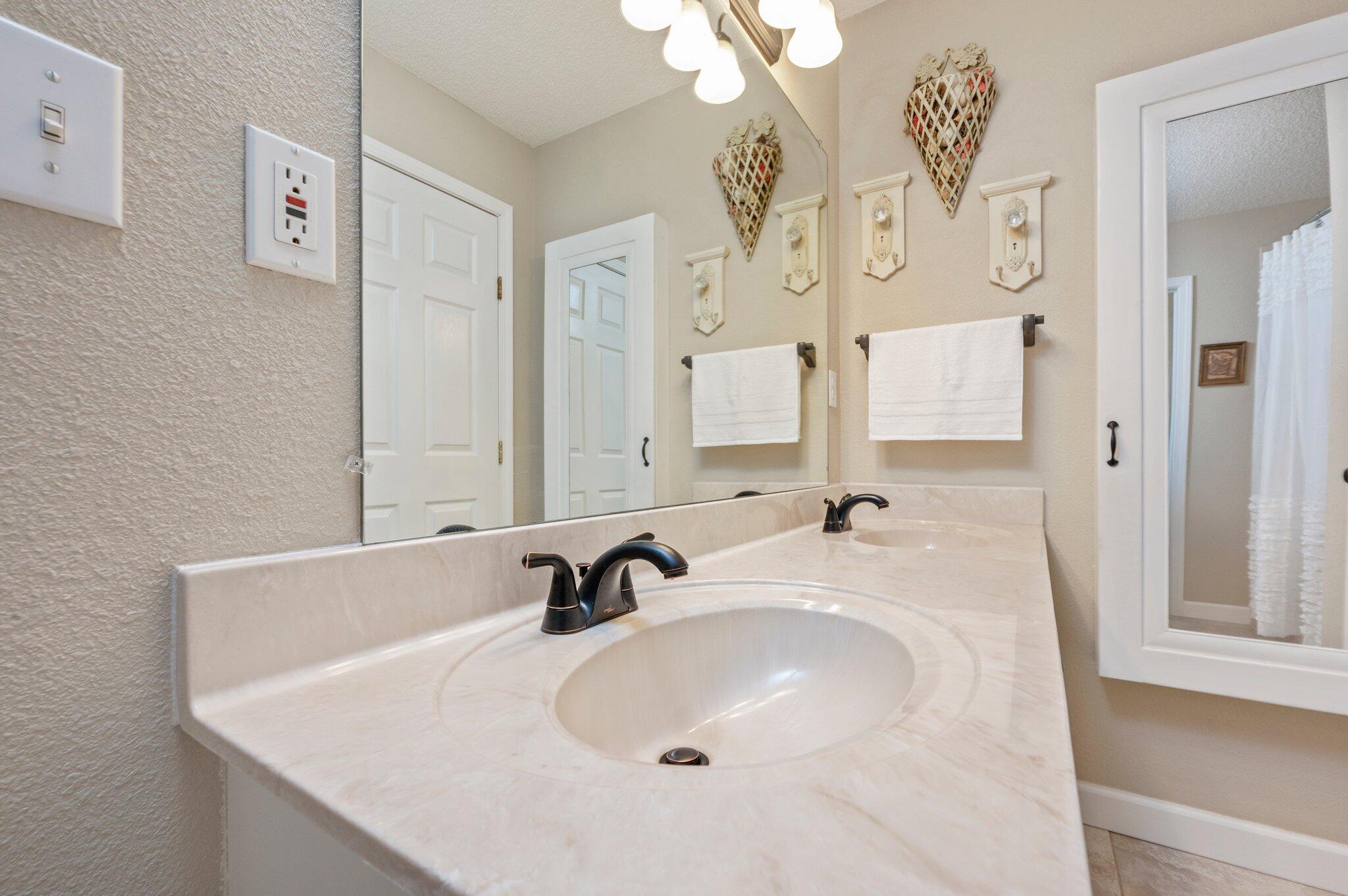 1084 Reeves Road Baker, FL 32531 - Photo 24 of 37 a bathroom with a sink and a mirror