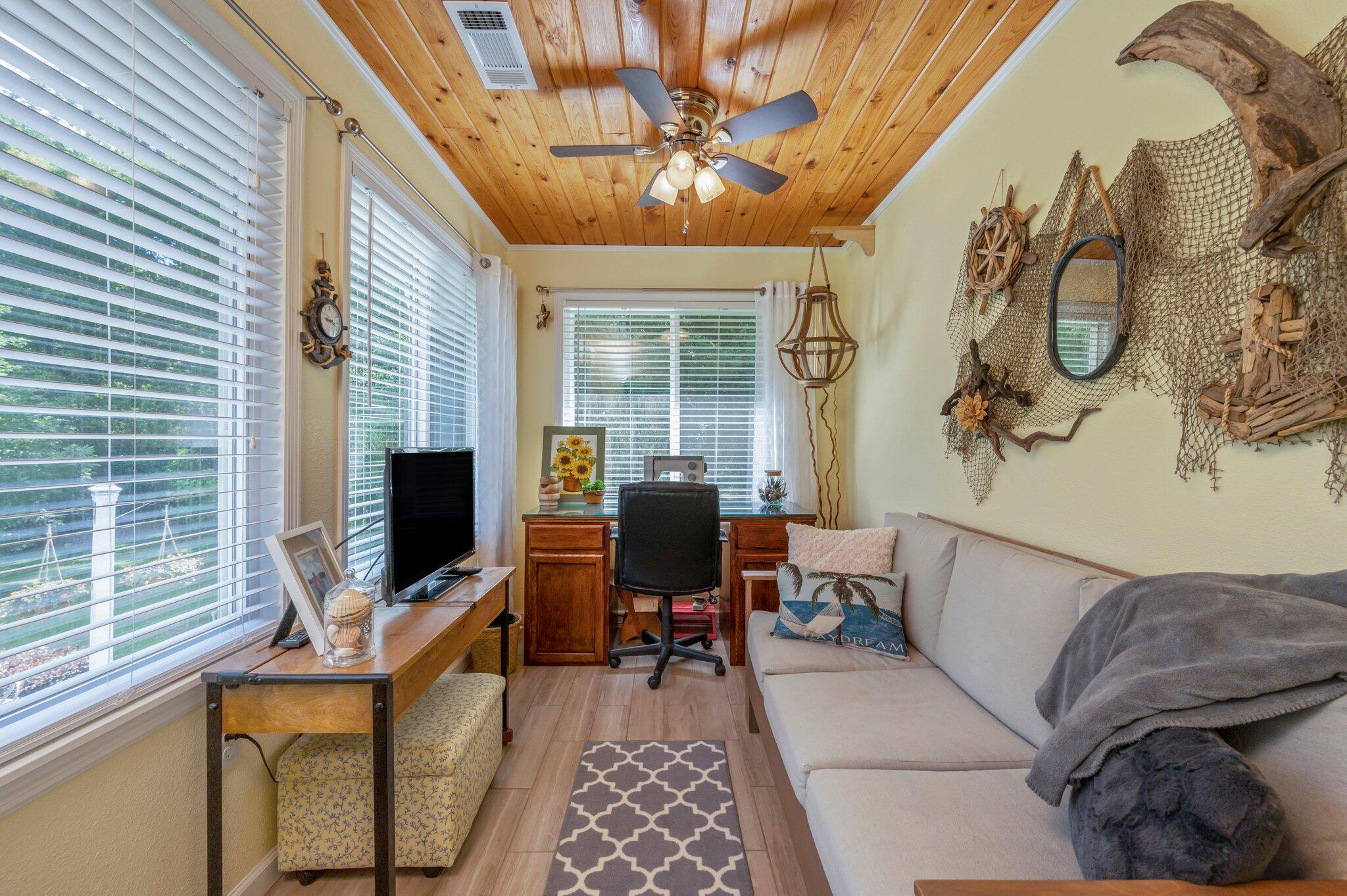 1084 Reeves Road Baker, FL 32531 - Photo 26 of 37 a living room with furniture and a flat screen tv