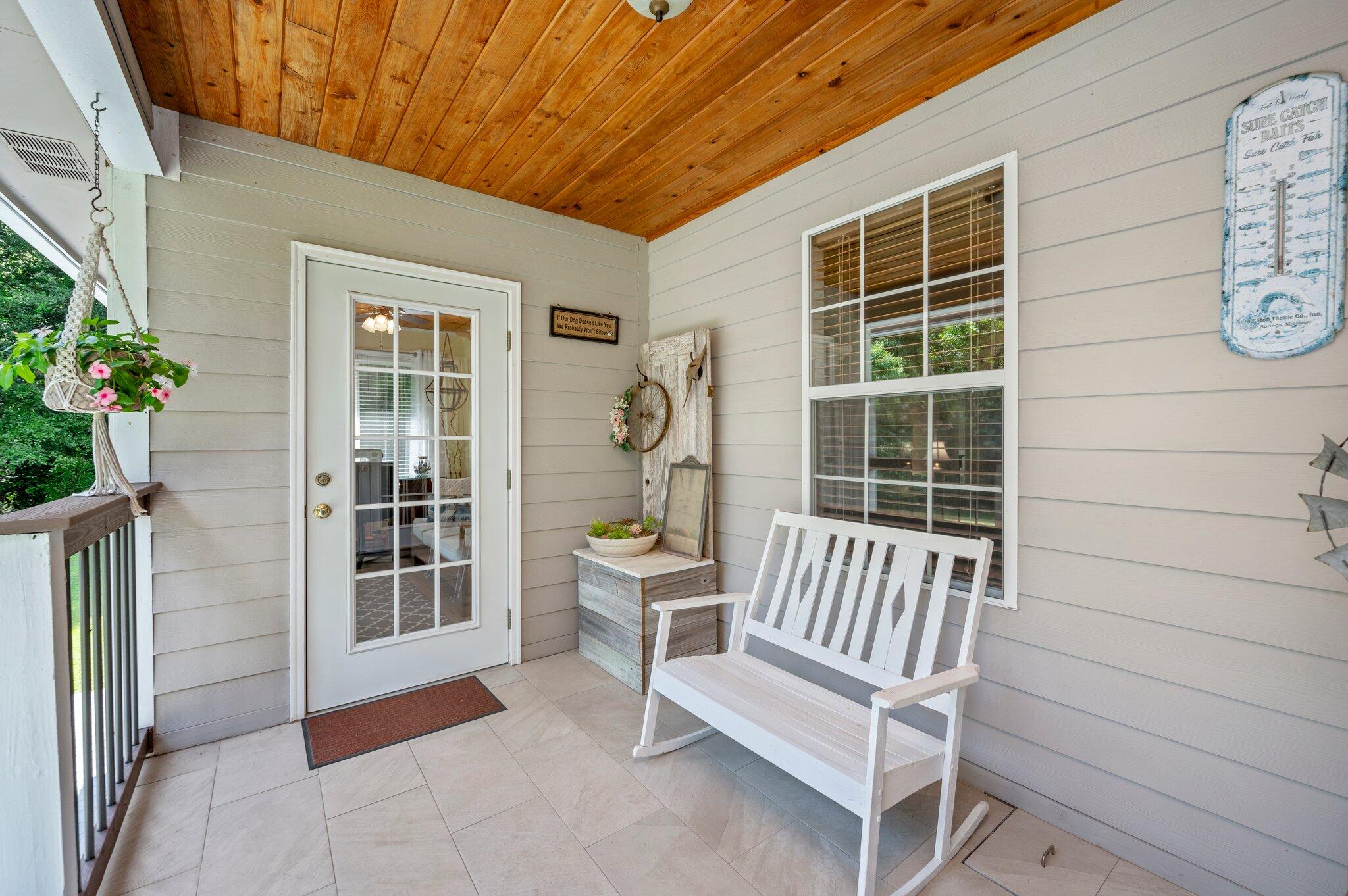 1084 Reeves Road Baker, FL 32531 - Photo 28 of 37 a view of a chair and table in the back yard of the house