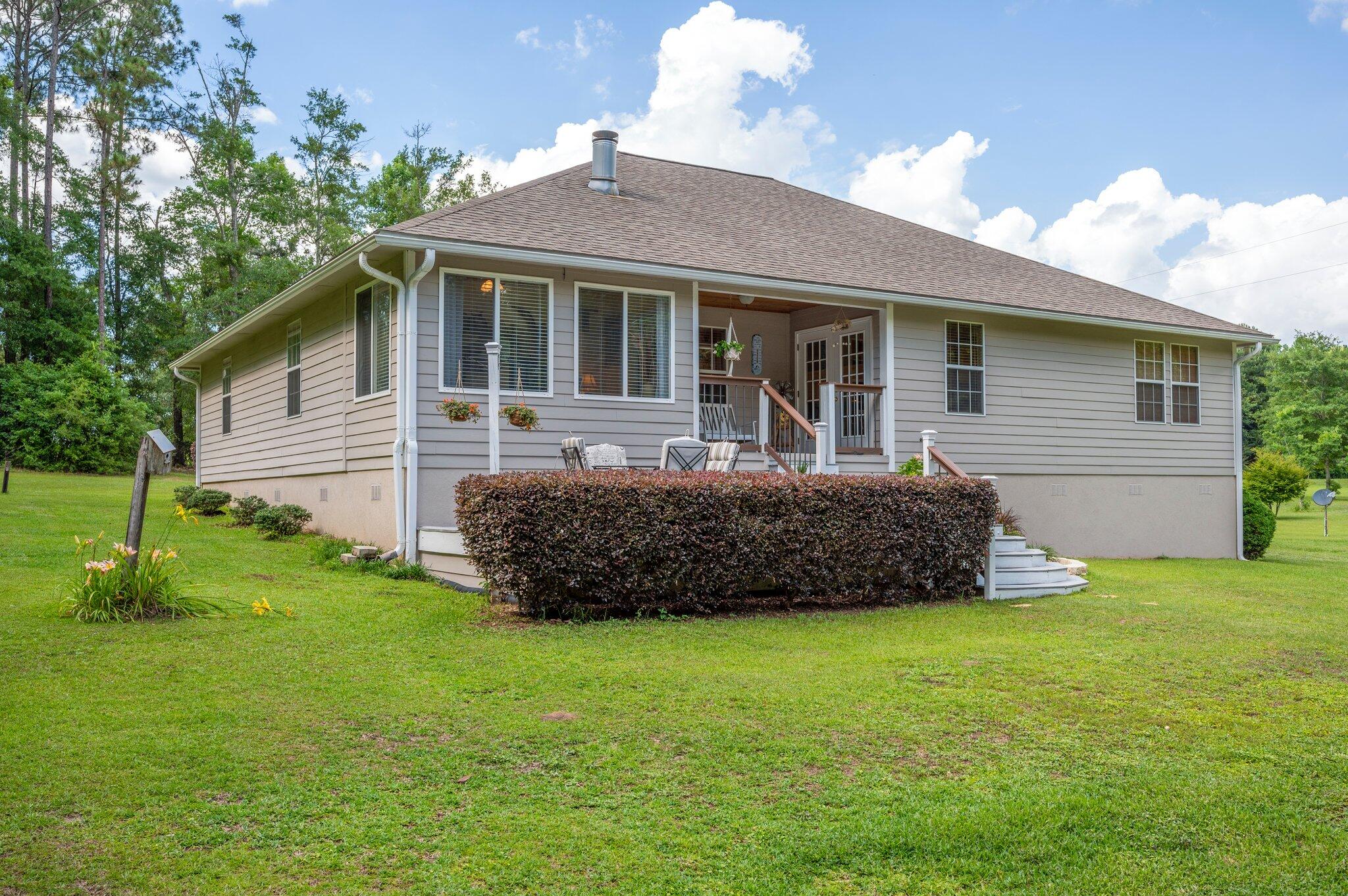 1084 Reeves Road Baker, FL 32531 - Photo 34 of 37 a front view of a house with a yard