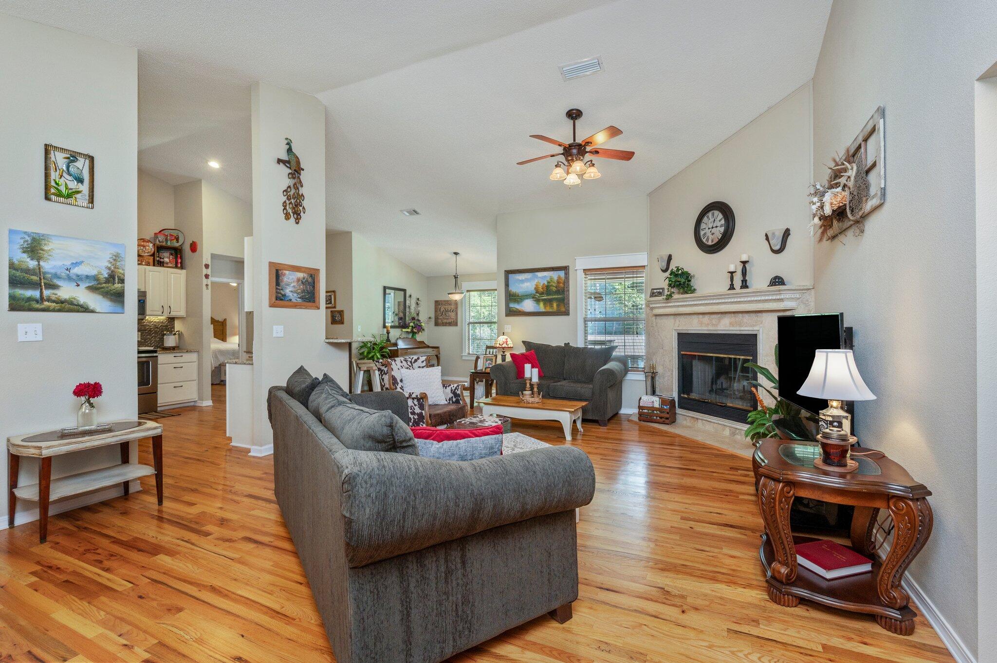1084 Reeves Road Baker, FL 32531 - Photo 6 of 37 a living room with furniture and a fireplace