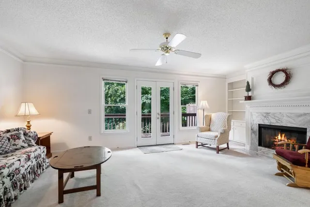 a view of a livingroom with furniture and a fireplace
