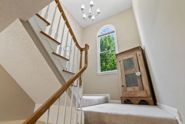 a living room with a bed furniture and a window