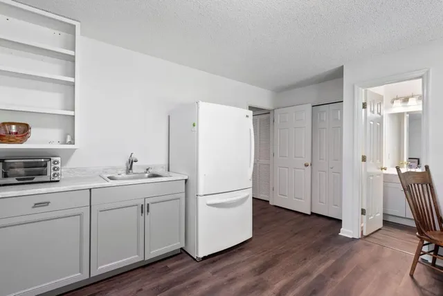 a refrigerator freezer sitting inside of a kitchen