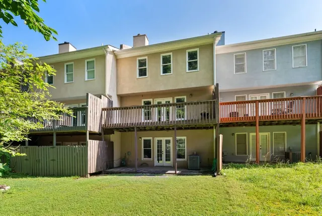 a front view of a house with a yard table and chairs