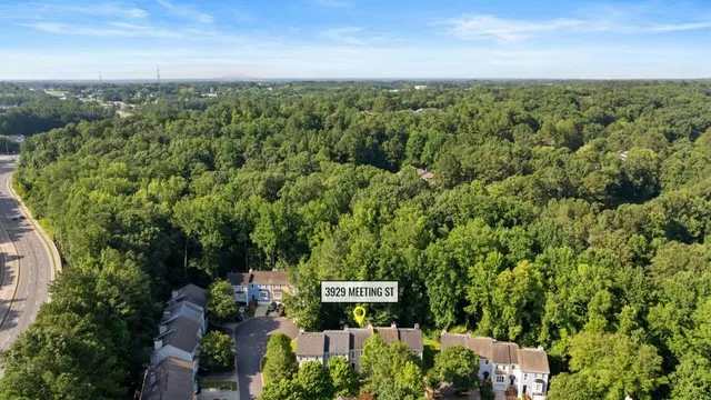 an aerial view of a city with lots of residential buildings