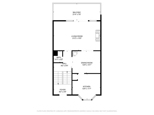 a picture of a bench in front of a wall