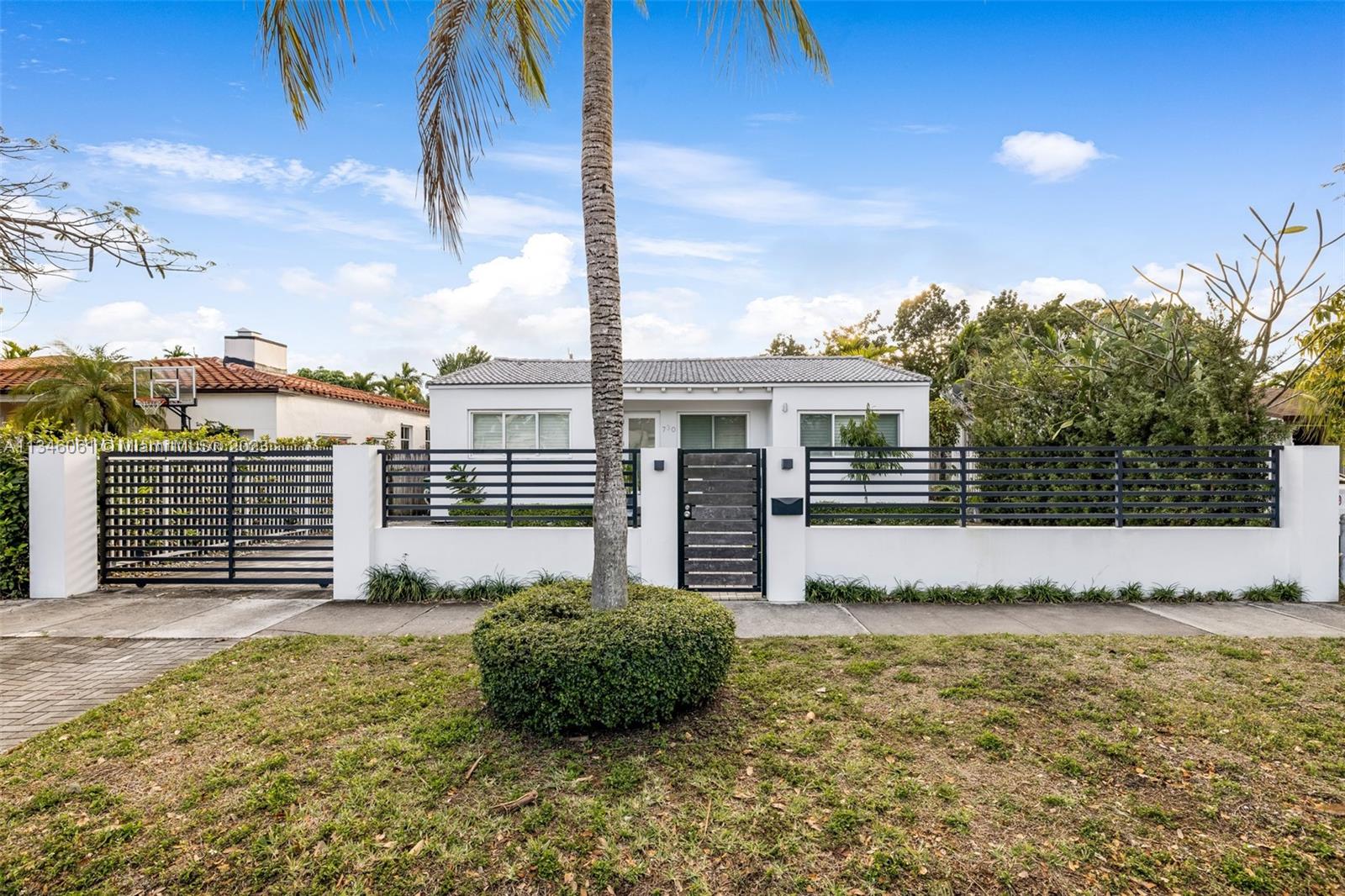 730 Southwest 26th Road Miami, FL 33129 - Photo 1 of 34 a view of a house with backyard and deck