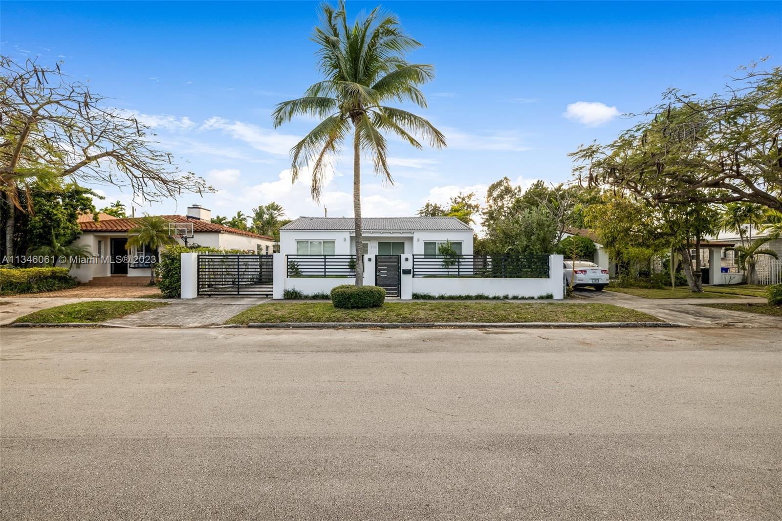 730 Southwest 26th Road Miami, FL 33129 - Photo 2 of 34 front view of a house with a yard