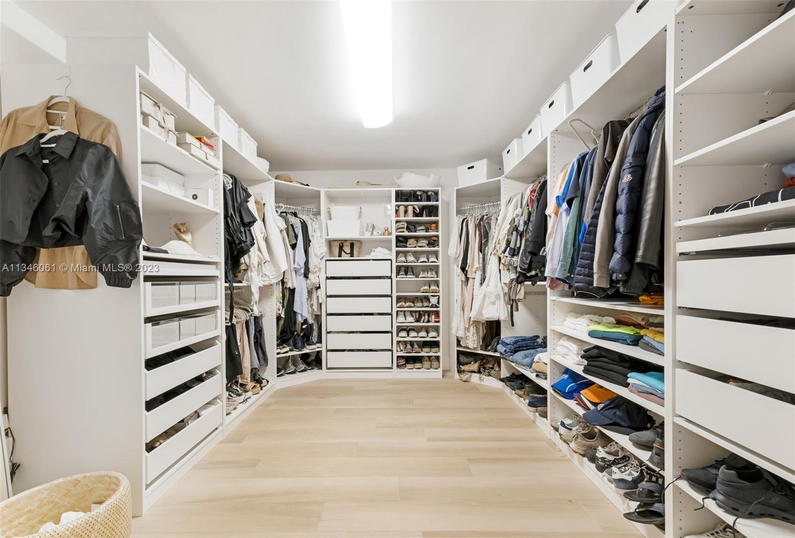 730 Southwest 26th Road Miami, FL 33129 - Photo 26 of 34 a view of walk in closet with clothes and shoes