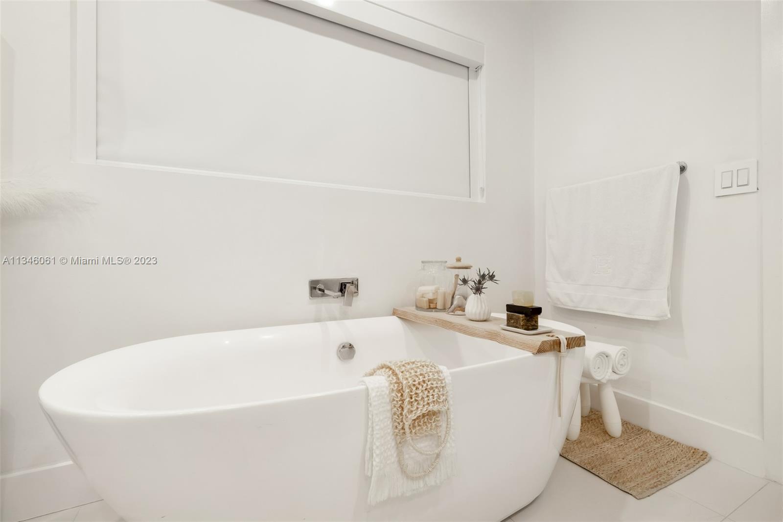 730 Southwest 26th Road Miami, FL 33129 - Photo 30 of 34 a white bath tub sitting next to a white sink