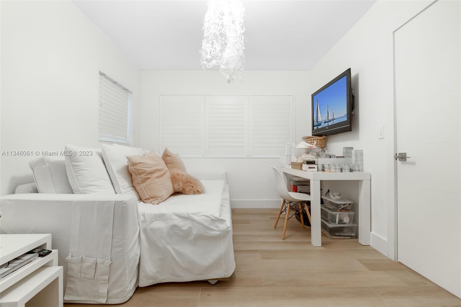 730 Southwest 26th Road Miami, FL 33129 - Photo 33 of 34 a bedroom with a bed and a flat screen tv