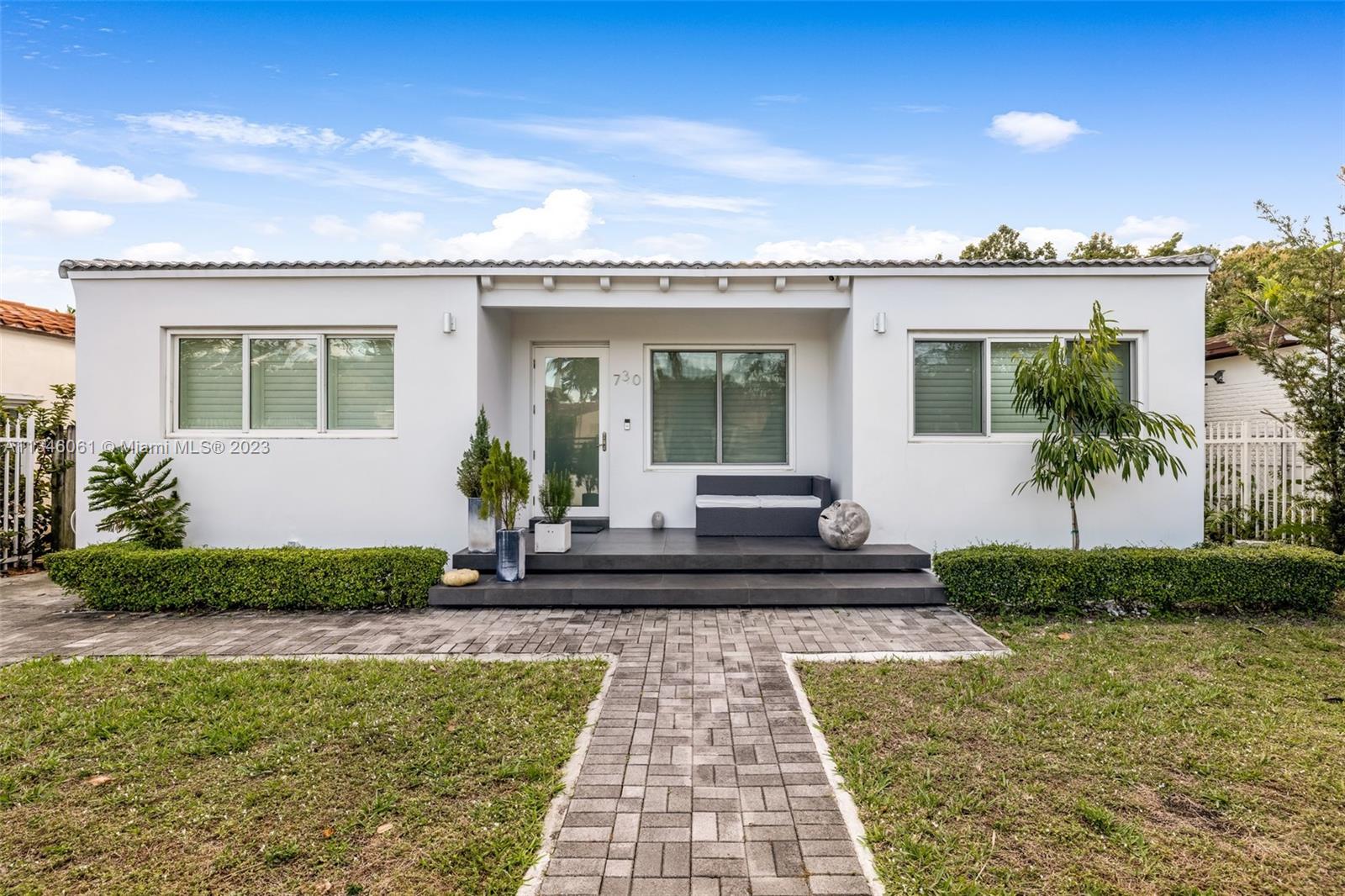 730 Southwest 26th Road Miami, FL 33129 - Photo 4 of 34 a front view of a house with garden