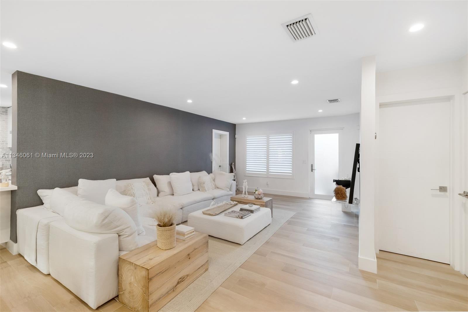 730 Southwest 26th Road Miami, FL 33129 - Photo 7 of 34 a living room with furniture and wooden floor