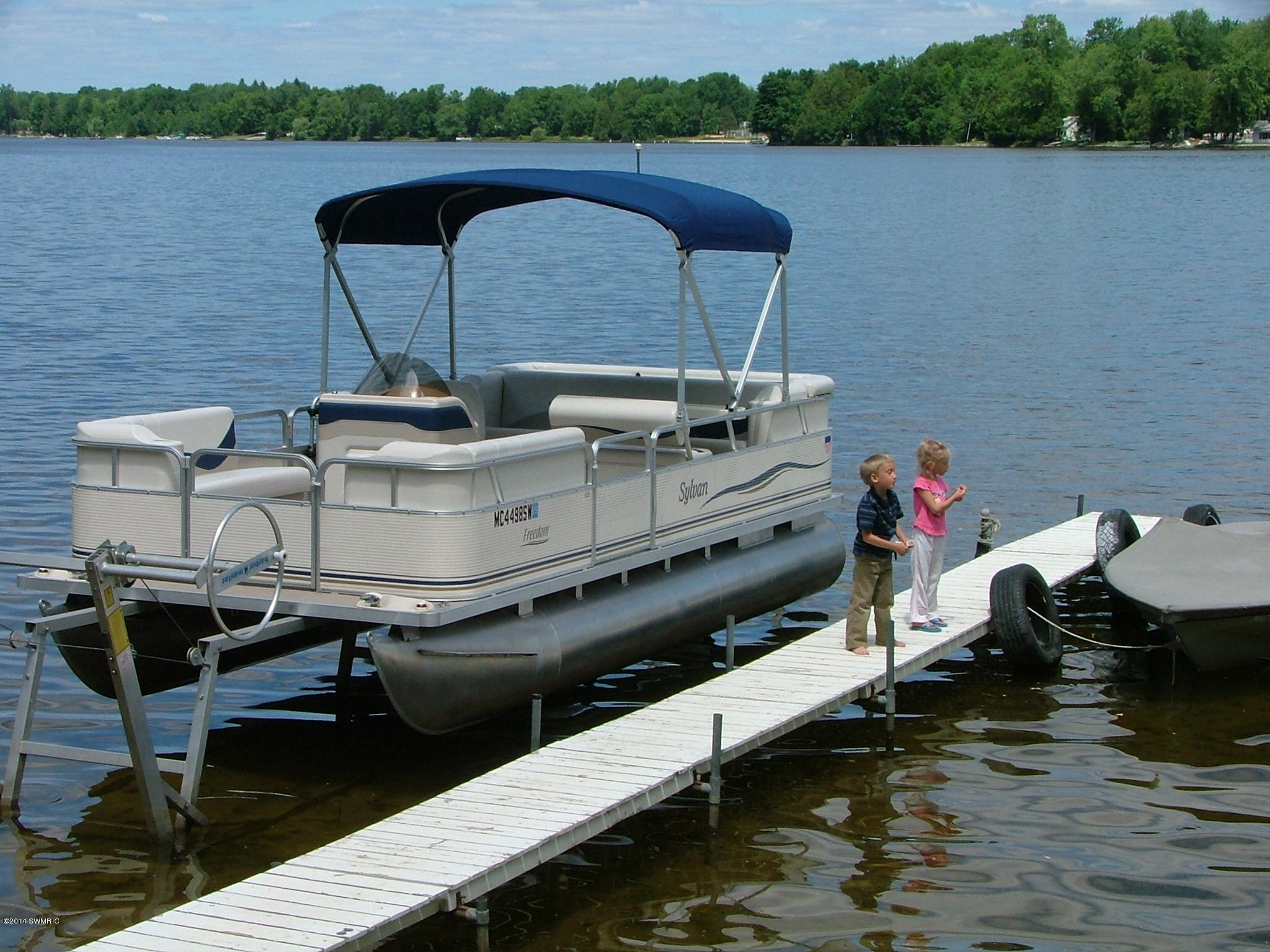 5182 West Jordan Road Weidman, MI 48893 - Photo 8 of 10 Dock with boat